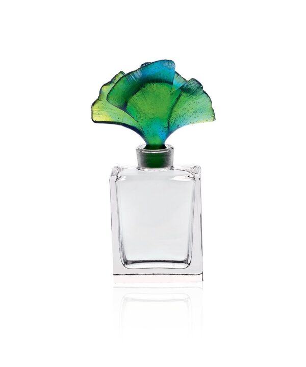 The Ginkgo Green Perfume Bottle, a crystal jewel in blue-green hues, captivating natural light.