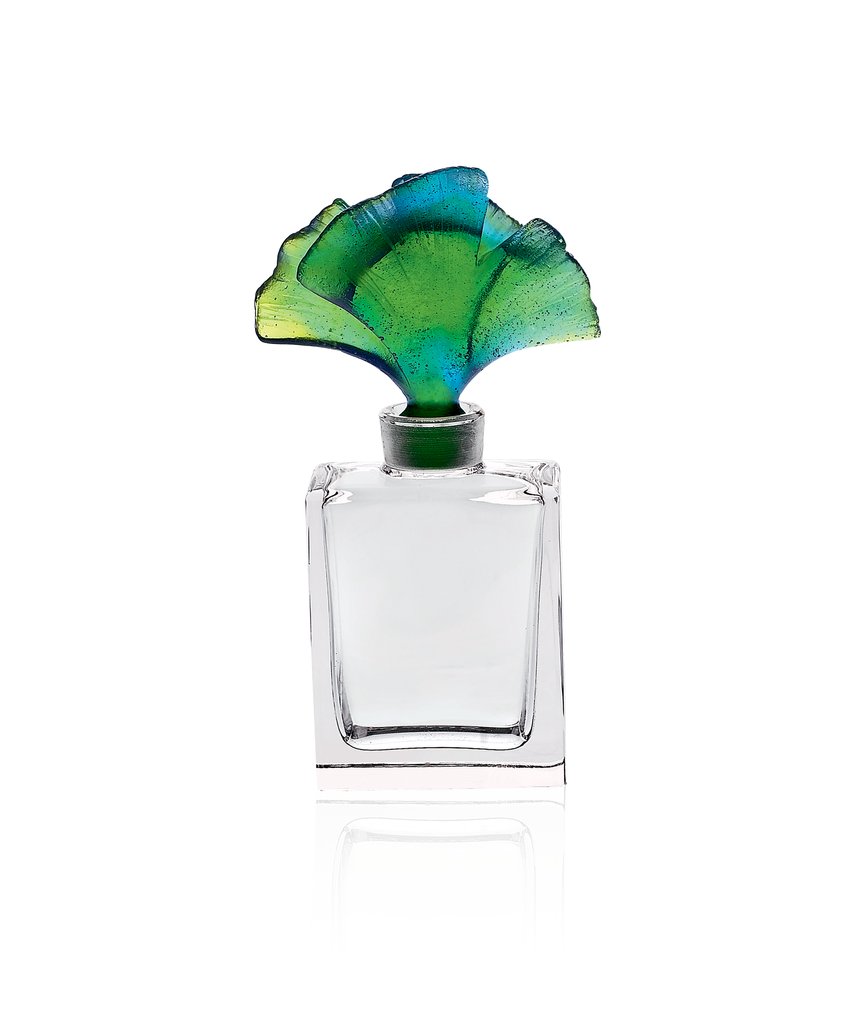 The Ginkgo Green Perfume Bottle, a crystal jewel in blue-green hues, captivating natural light.