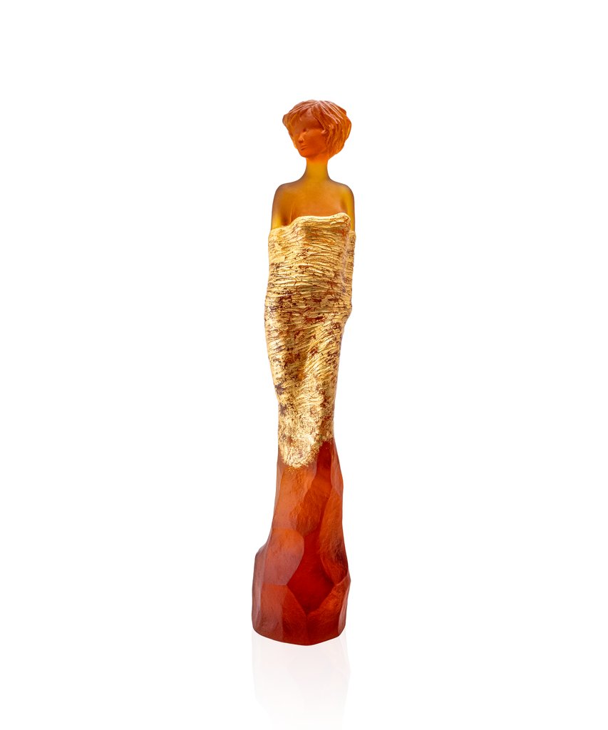 JP Richard's Amber and Gold Galatea feminine sculpture, a striking expression in crystal, radiates illumination with its magnetic presence.